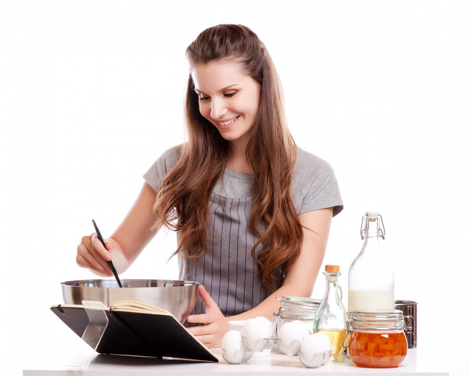 Student cooking in a compact kitchen